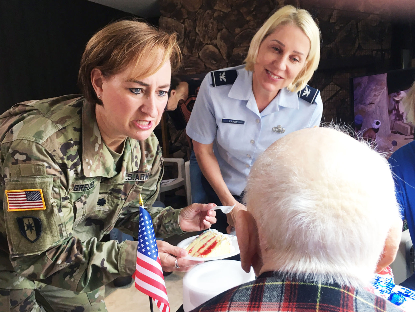 Darcie Greuel and Ann Knabe visit WWII veteran Roland 'Bud' Pater at 106th birthday
